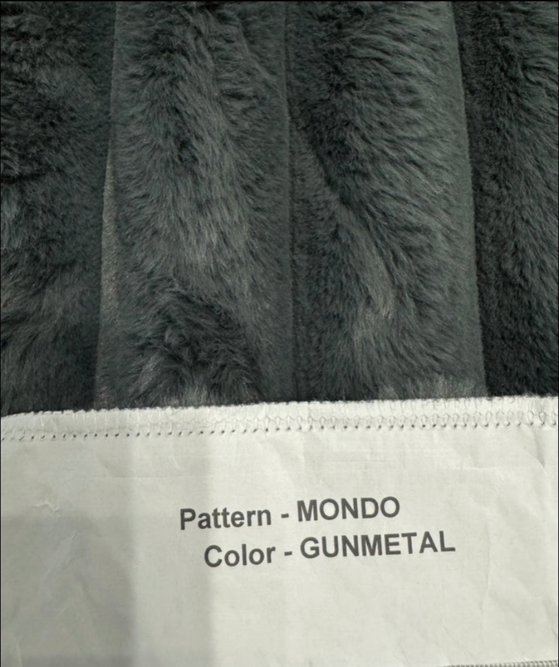 Close-up of textured fabric with 'Pattern - MONDO' and 'Color - GUNMETAL' text.
