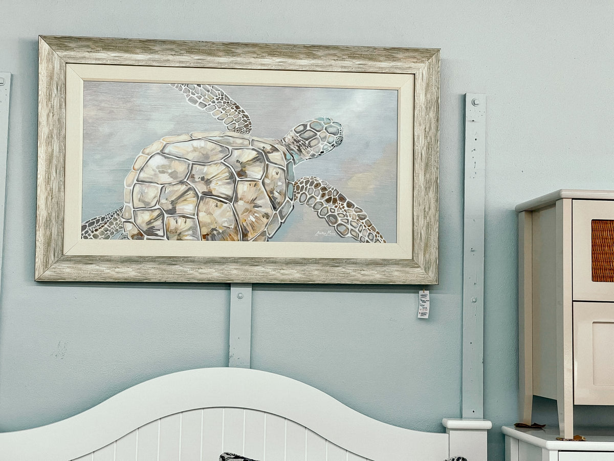Anastasia Musick large framed sea turtle print above a dresser at Atlantic Fine Furniture Melbourne FL