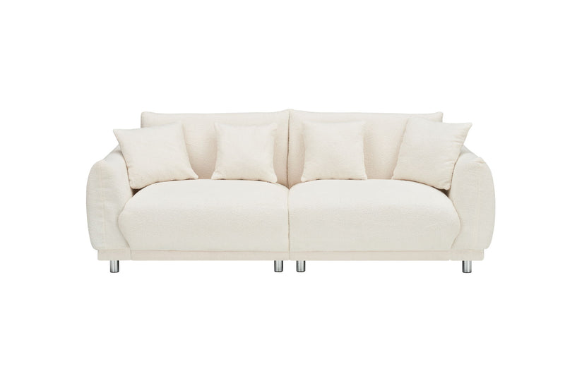 Teddy Wool Beige Sofa With Four Throw Pillows And Hardware Feet Can Sit Comfortably In An Apartment Bedroom Without Taking Up Space