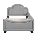 Twin Size Upholstered Daybed with Cloud Shaped Headboard, Embedded Elegant Copper Nail Design, Gray