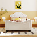Twin Size Upholstered Daybed with Cloud Shaped Headboard, Embedded Elegant Copper Nail Design, Beige