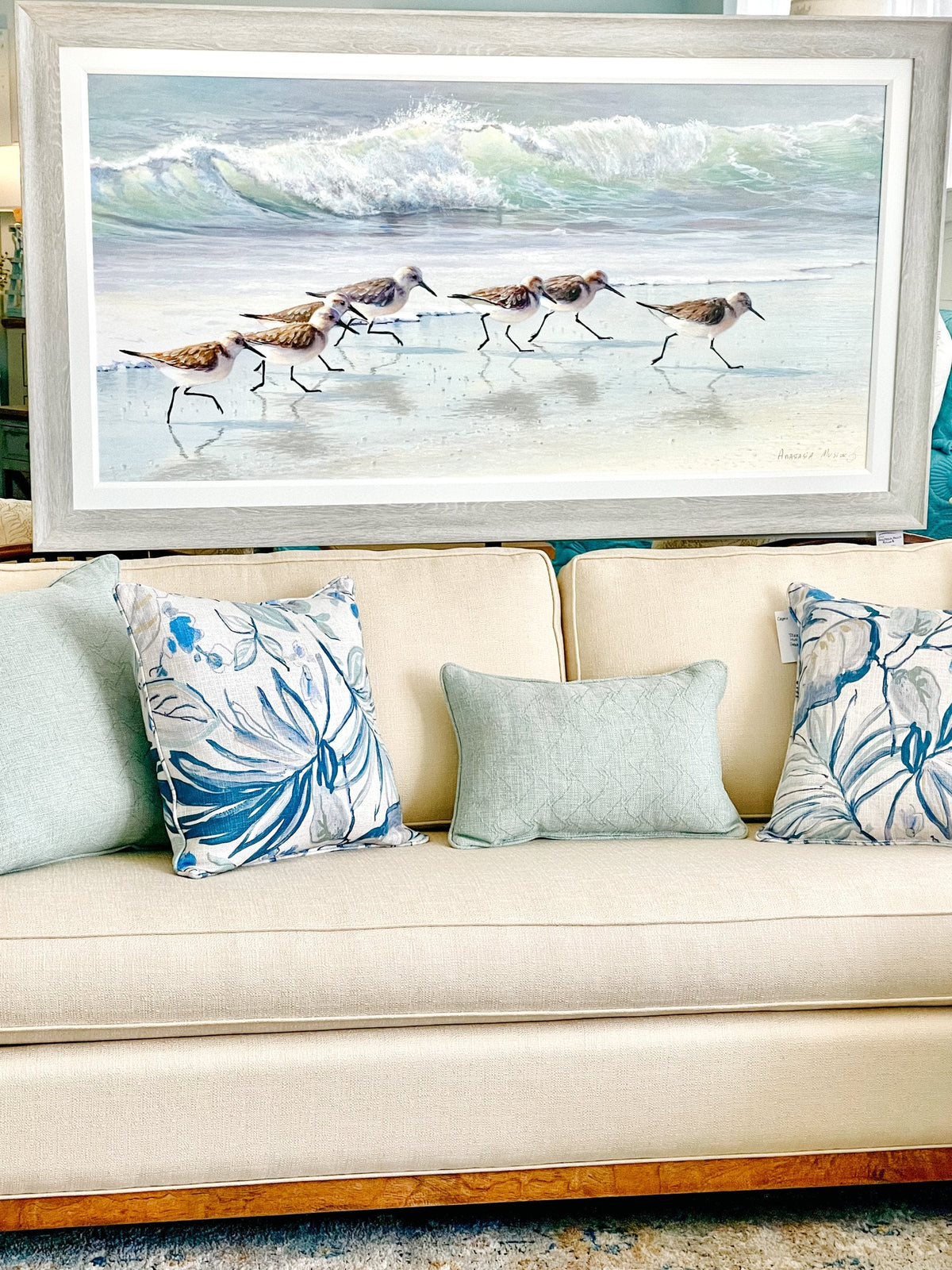Anastasia Musick shorebird print styled above a sofa at Atlantic Fine Furniture