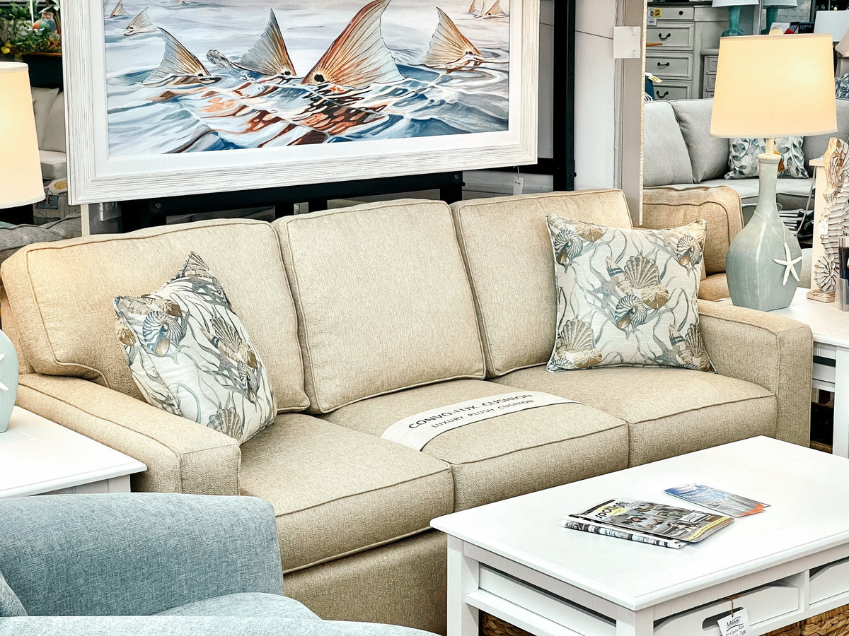 Anastasia Musick rays print styled above a sectional at Atlantic Fine Furniture
