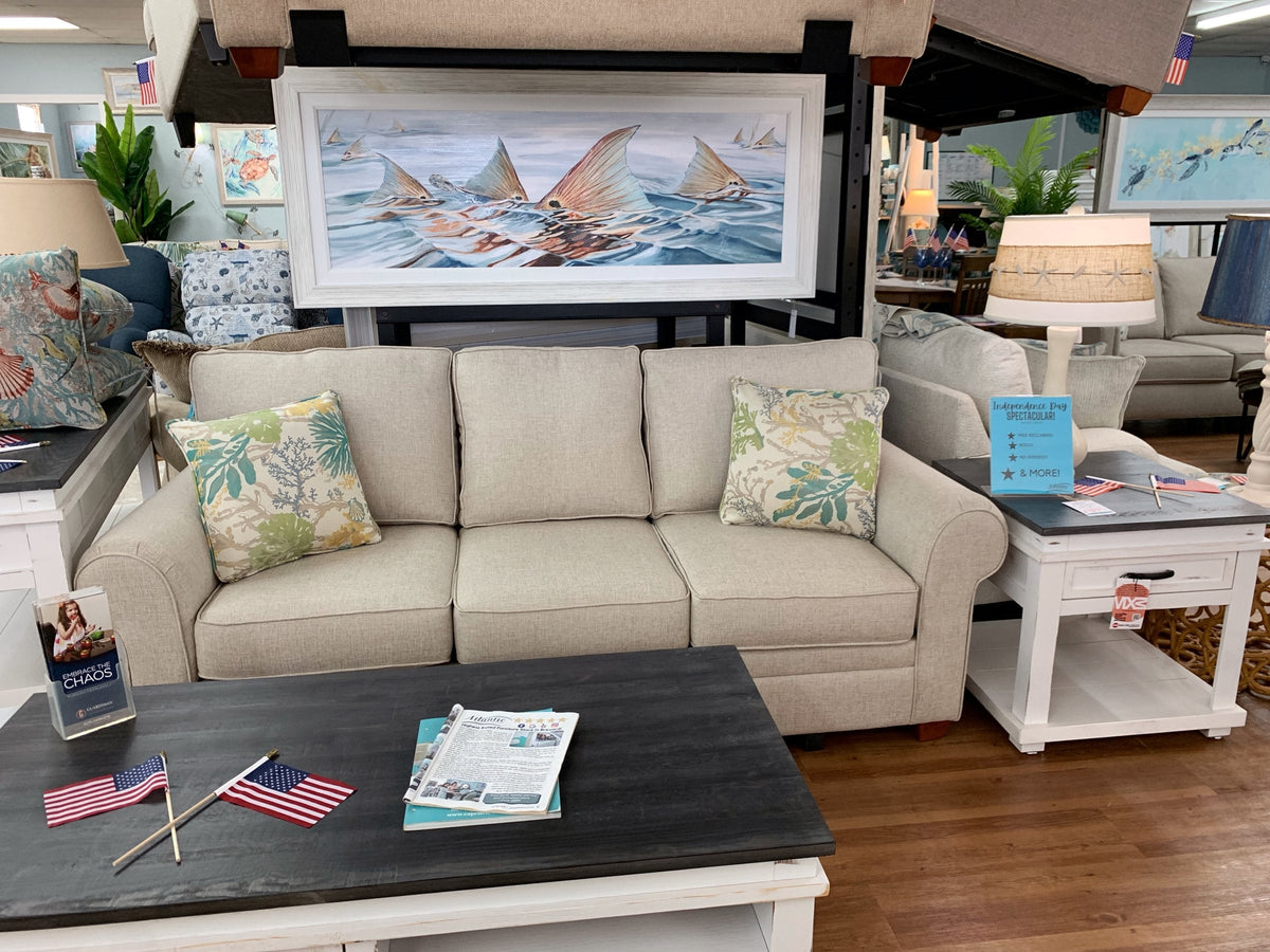 Anastasia Musick rays print styled above a sofa at Atlantic Fine Furniture