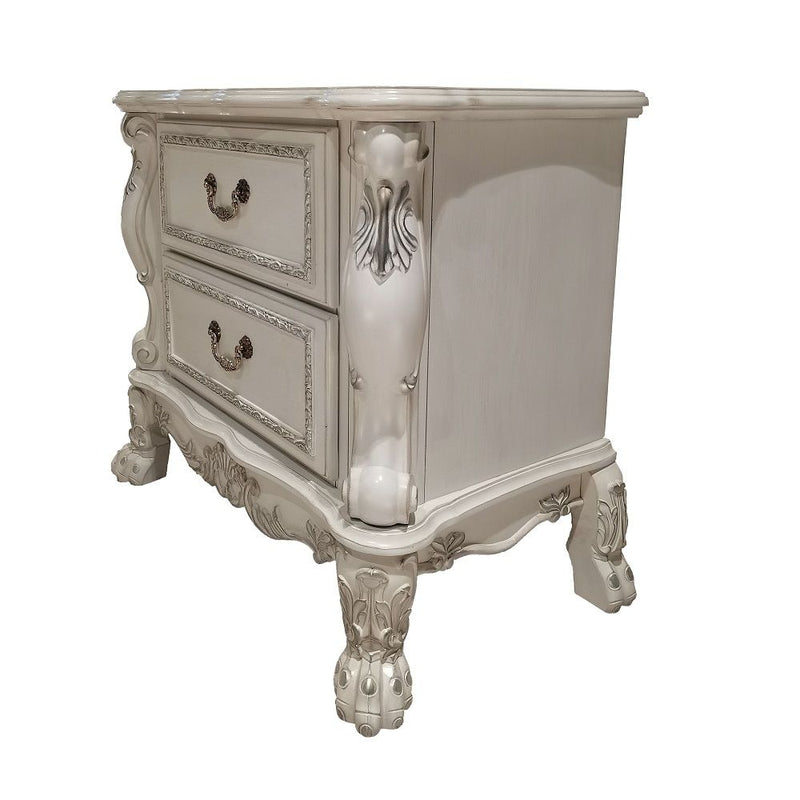 The Dresden Nightstand offers beautiful craftsmanship and artistic carvings. It features solid hardwood with two drawers for storage with coordinating carvings. The drawers feature dove tail construction and are decorated with antique brass hardware.