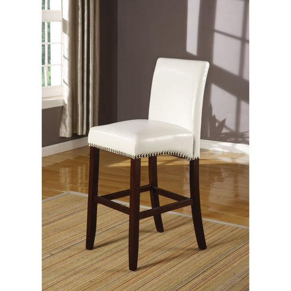 The Jakki sophisticated counter chair features crisp bycast leather and elegant nailhead trim details. The bycast leather seat and back with nailhead bottom accent trim will stand out as bold and stylish. Available in white and black.