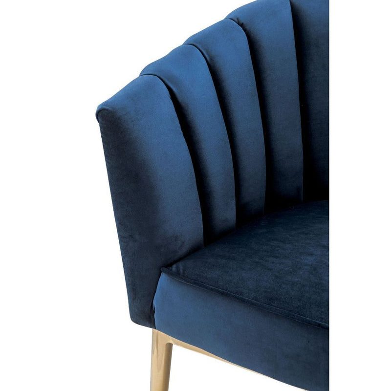 Refined carving with authentic styling, the Colla accent chair is the embodiment of elegance. The thick padded velvet cushion with straight-lined detailing offers superior coziness.