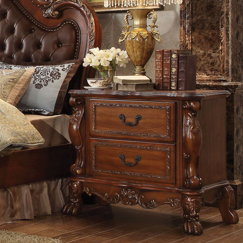 The Dresden Nightstand offers beautiful craftsmanship and artistic carvings. It features solid hardwood with two drawers for storage with coordinating carvings. The drawers feature dove tail construction and are decorated with antique brass hardware.