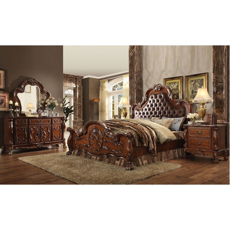 The Dresden Nightstand offers beautiful craftsmanship and artistic carvings. It features solid hardwood with two drawers for storage with coordinating carvings. The drawers feature dove tail construction and are decorated with antique brass hardware.